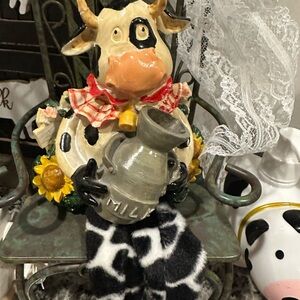 Somewhat quirky handcrafted cow figurine.